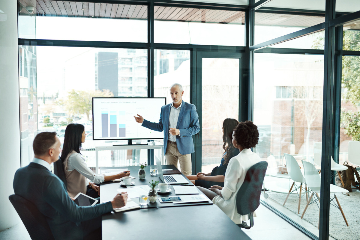 A businessman giving a presentation to colleagues